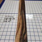 BLACK AND WHITE EBONY RISER BLOCK